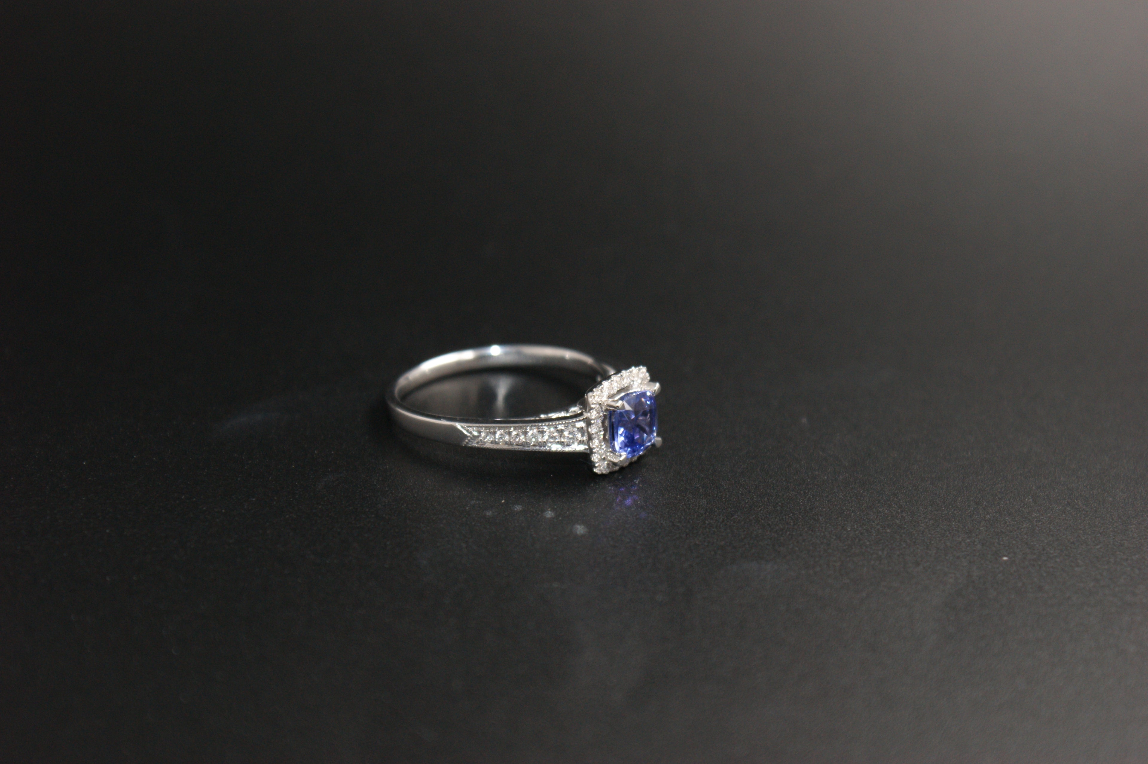032-18ct White Gold Tanzanite & 0.22ct Diamond Cushion Halo Ring