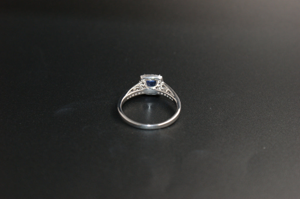 032-18ct White Gold Tanzanite & 0.22ct Diamond Cushion Halo Ring