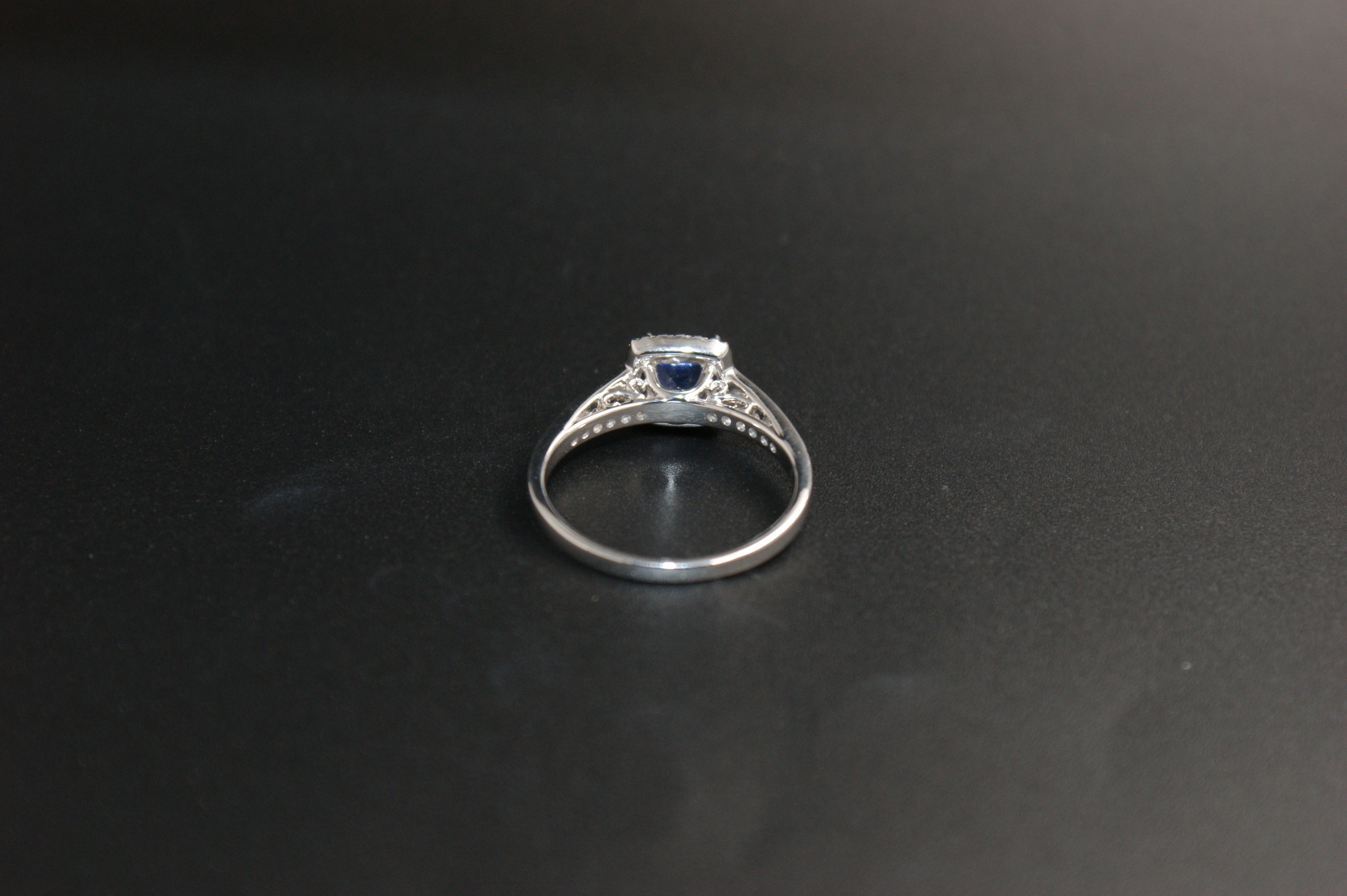032-18ct White Gold Tanzanite & 0.22ct Diamond Cushion Halo Ring