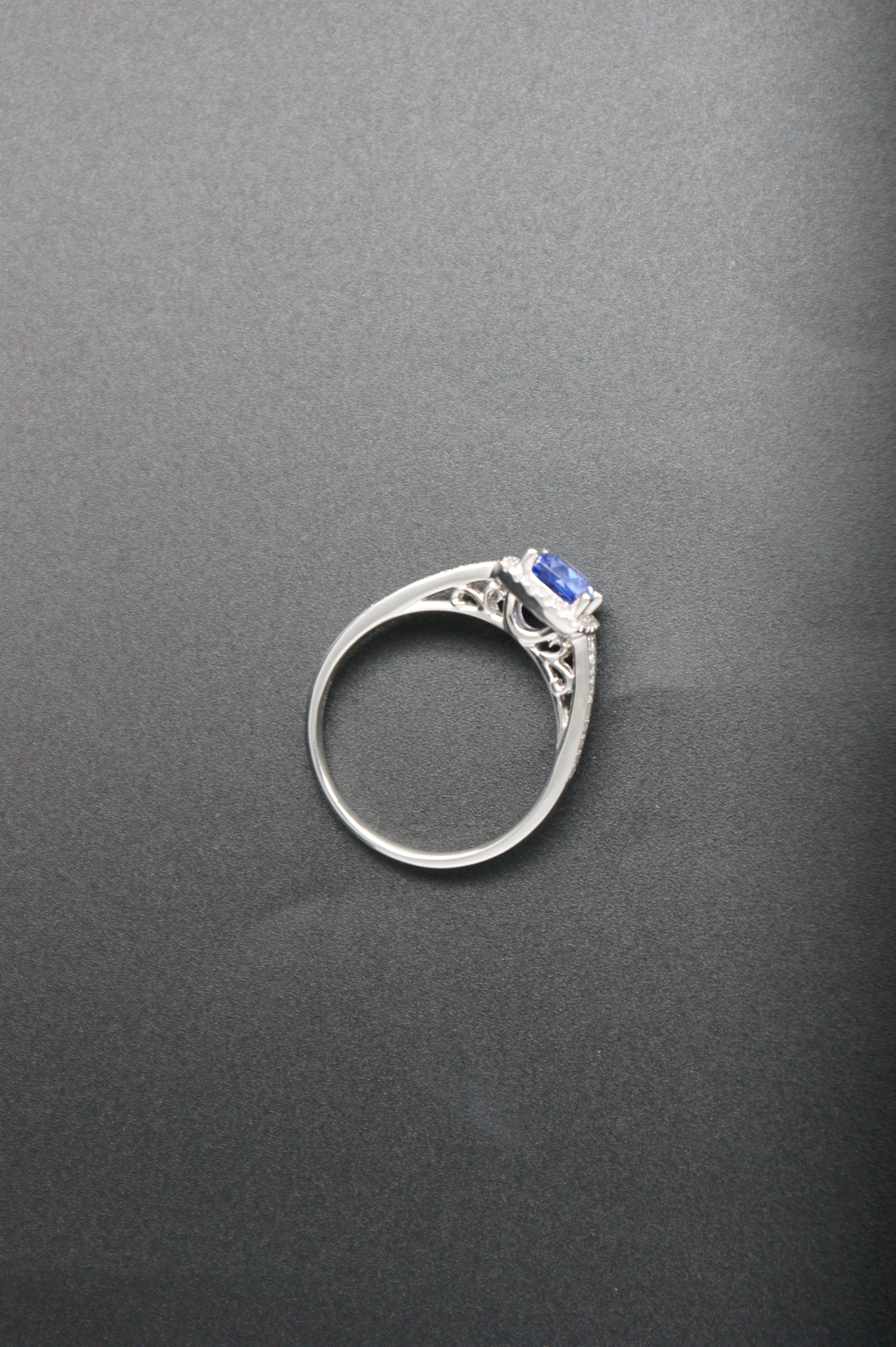 032-18ct White Gold Tanzanite & 0.22ct Diamond Cushion Halo Ring