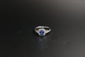 032-18ct White Gold Tanzanite & 0.22ct Diamond Cushion Halo Ring
