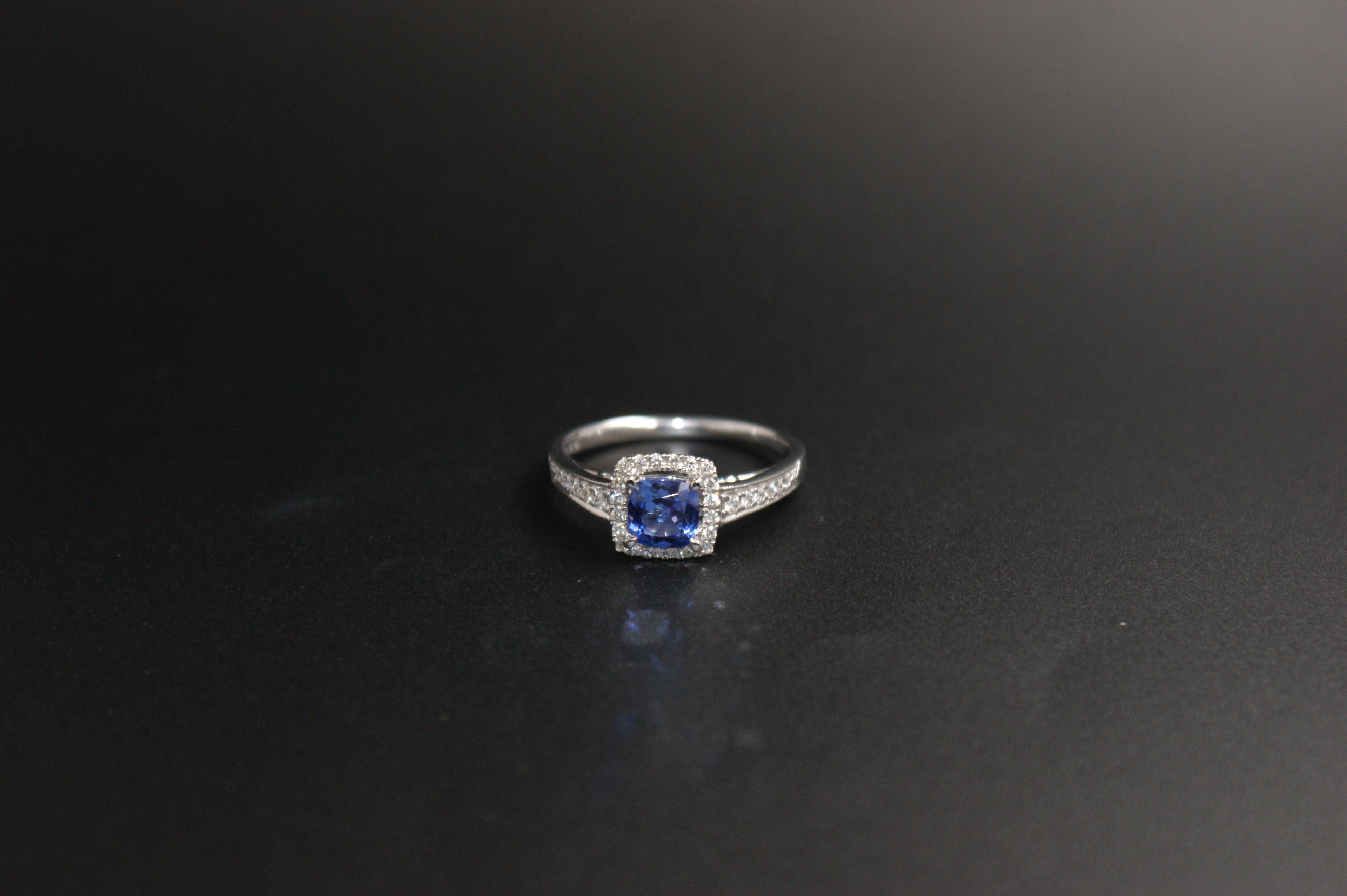 032-18ct White Gold Tanzanite & 0.22ct Diamond Cushion Halo Ring