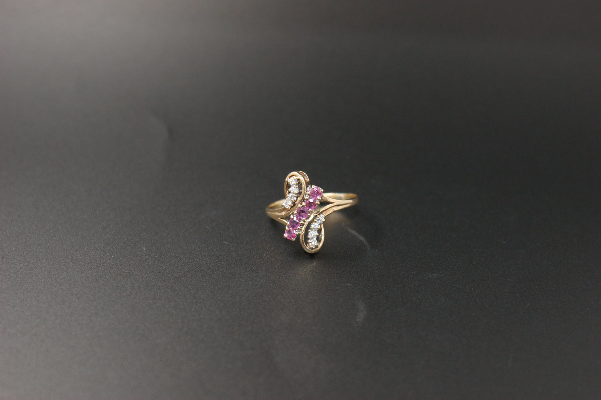 047-9ct Gold Ruby & Diamond Crossover Ring