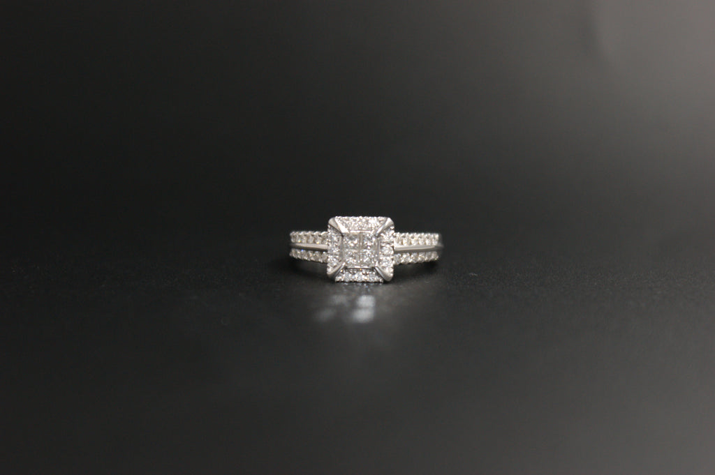 058- 18ct white diamond halo ring