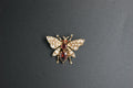 081- 9ct garnet and pearl Bee brooch.