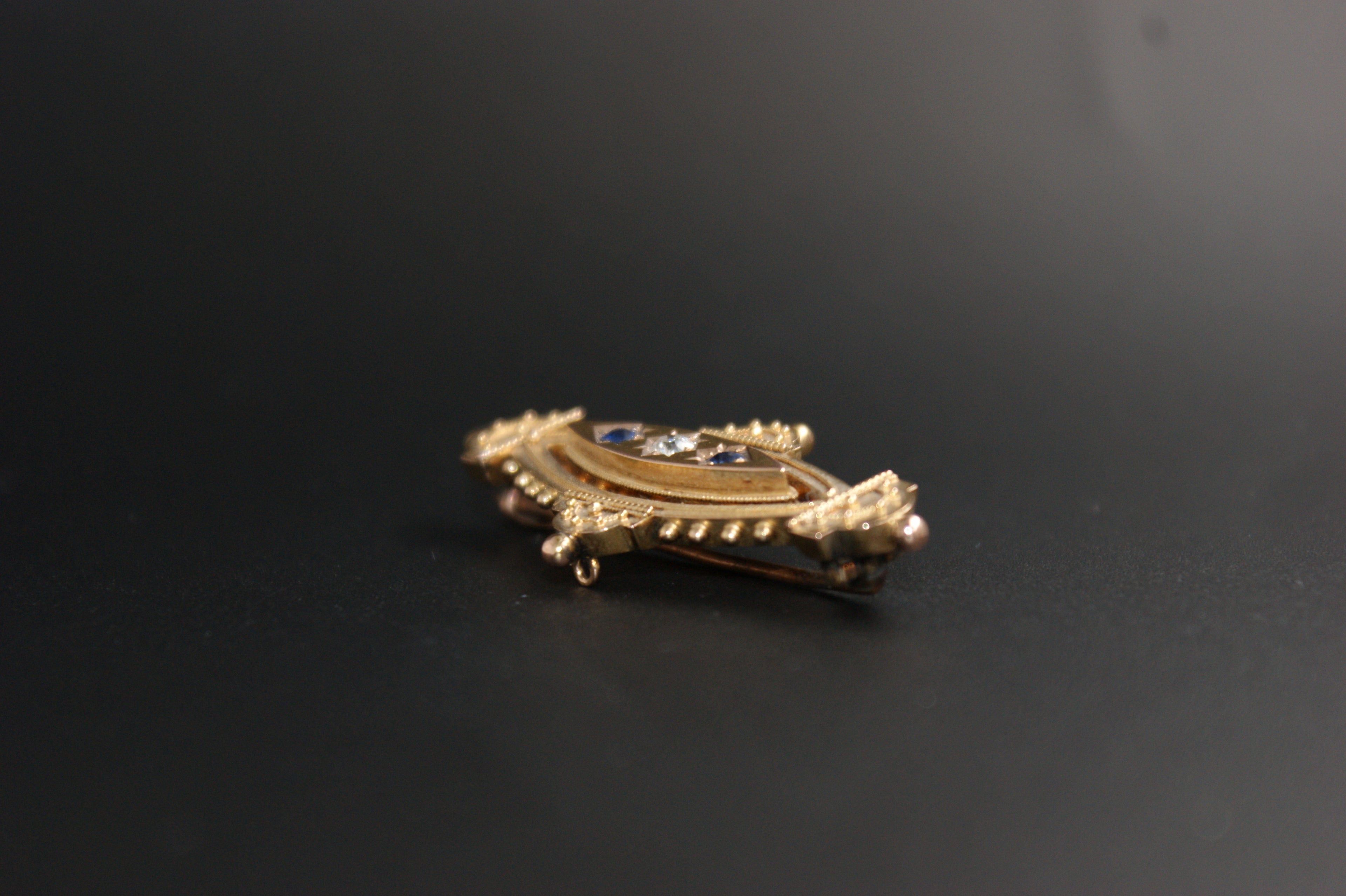 083- 15ct sapphire and diamond Brooch.