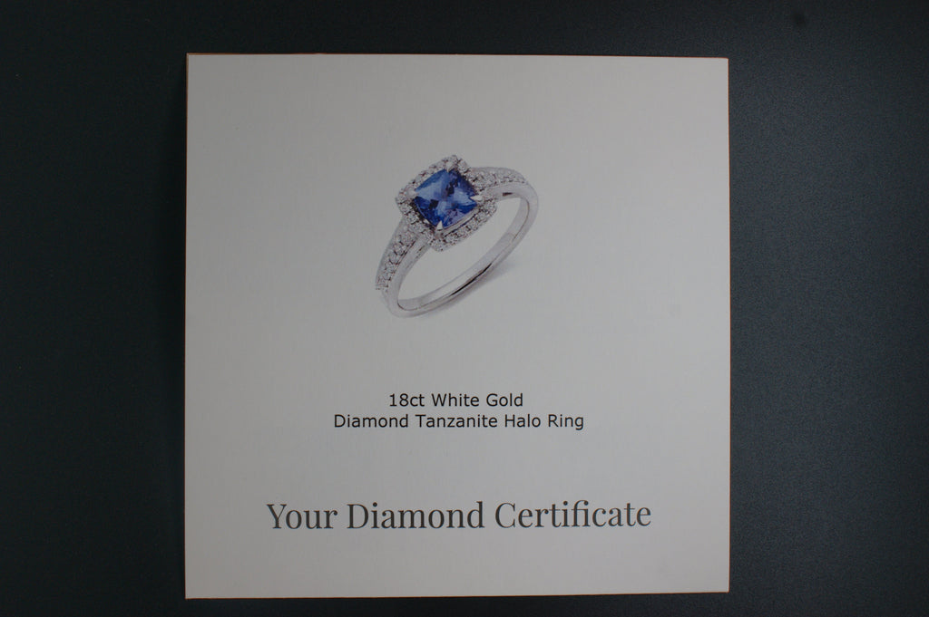 032-18ct White Gold Tanzanite & 0.22ct Diamond Cushion Halo Ring