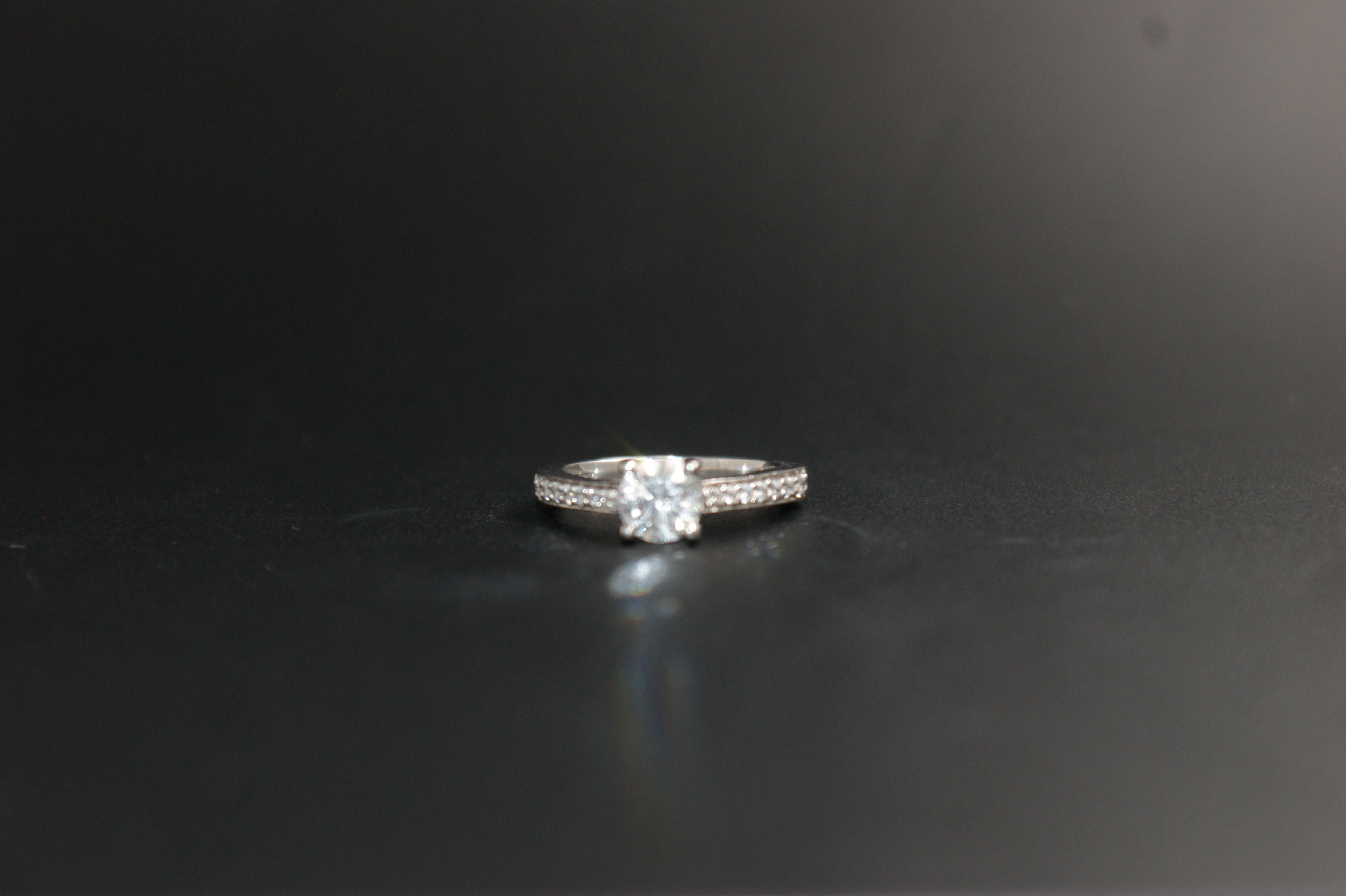 097-Platinum 063ct Solitaire Diamond Ring with Pave Shoulders