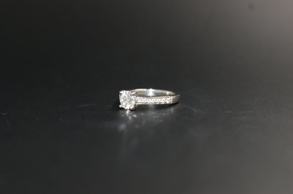 097-Platinum 063ct Solitaire Diamond Ring with Pave Shoulders