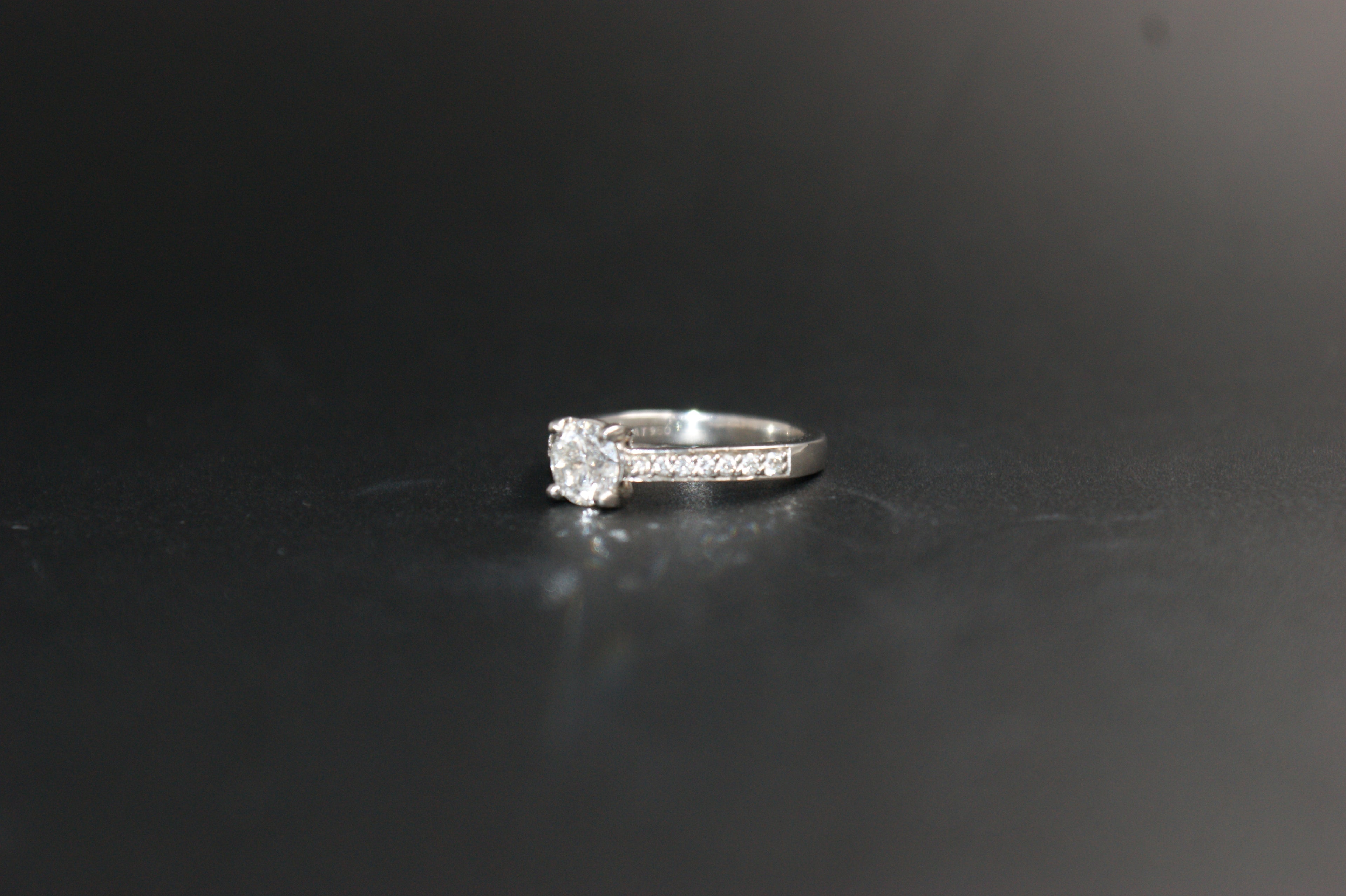 097-Platinum 063ct Solitaire Diamond Ring with Pave Shoulders