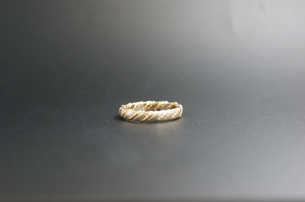 0119- 18ct two-toned twisted wedding band.