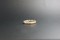 0119- 18ct two-toned twisted wedding band.