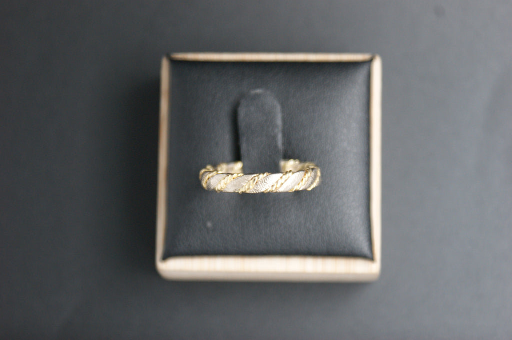 0119- 18ct two-toned twisted wedding band.