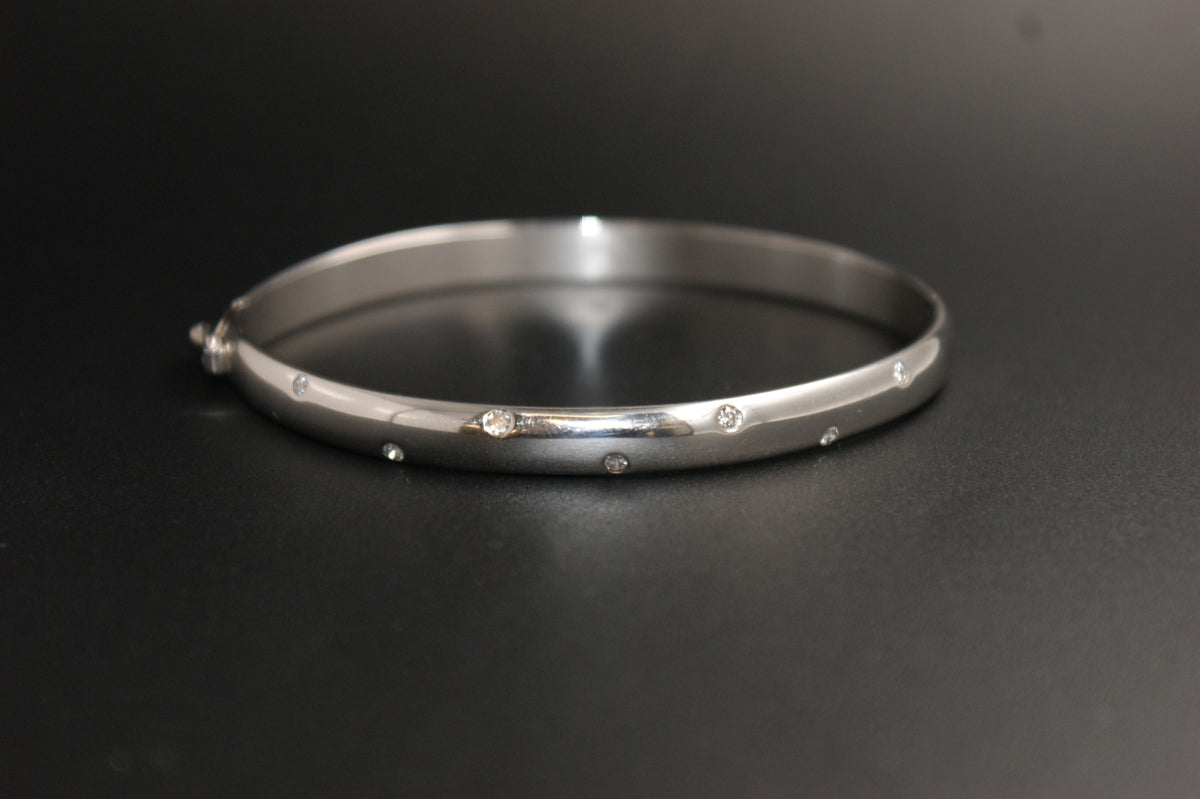 0168- 18ct White Gold Diamond Flush-Set Hinged Bangle