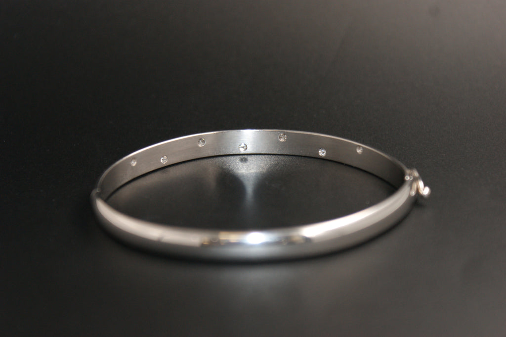 0168- 18ct White Gold Diamond Flush-Set Hinged Bangle