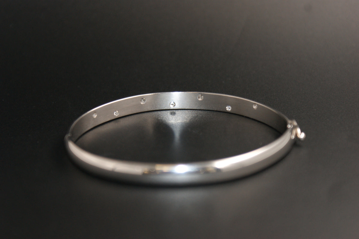 0168- 18ct White Gold Diamond Flush-Set Hinged Bangle