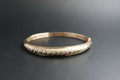 0169- 9ct Gold Diamond Twist-Front Bangle