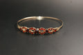 0170- 9ct Gold Garnet Cluster Openwork Bangle