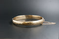 0173- 9ct Gold Engraved Scroll-Front Hinged Bangle