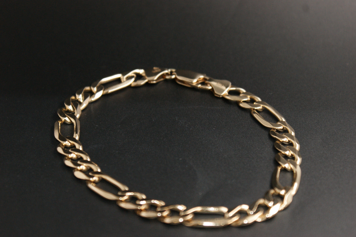 0187- 9ct Gold Figaro Bracelet.
