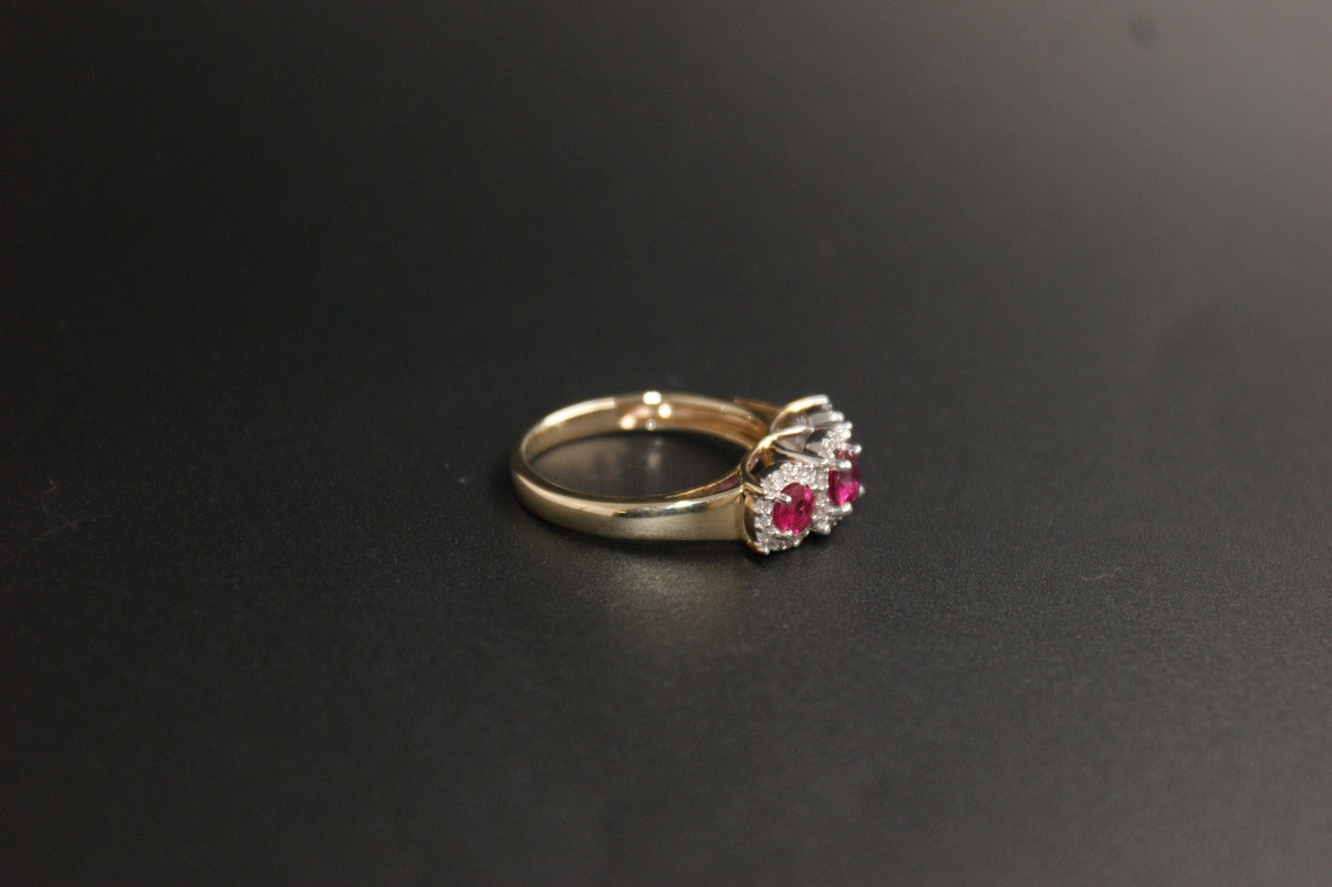 0212- 9ct Gold Three-Stone Ruby and Diamond Halo Ring