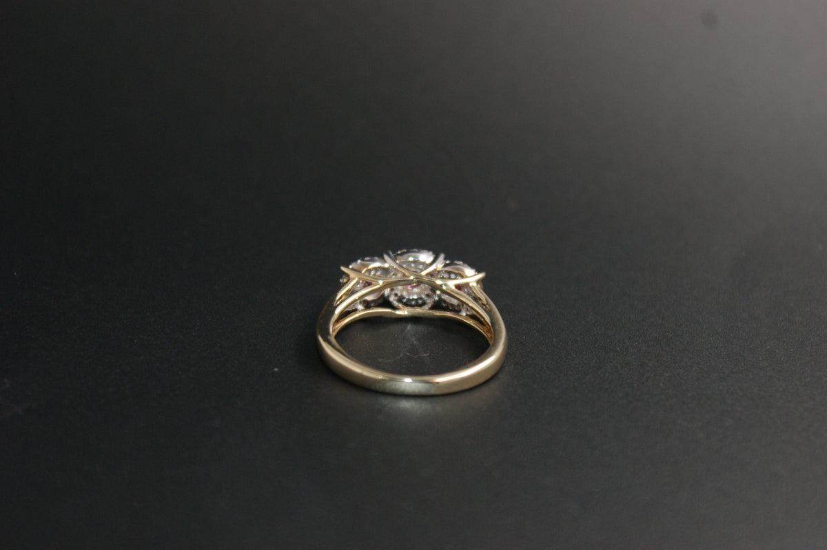 0212- 9ct Gold Three-Stone Ruby and Diamond Halo Ring