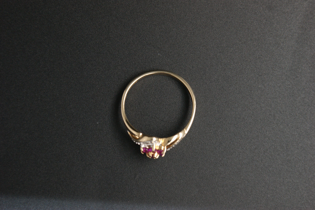 0213- 9ct Gold Ruby and Diamond Crossover Ring